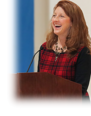 Woman at podium laughing